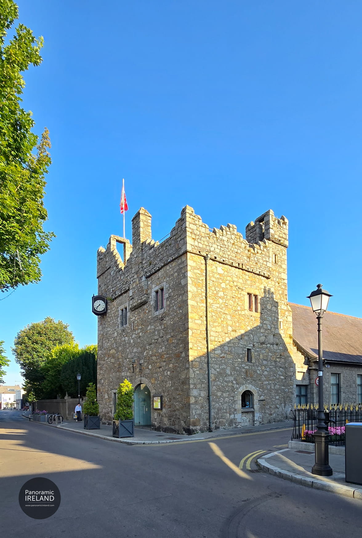 14th Century medieval tower in Dalkey called Dalkey Castle on a blue sky day.