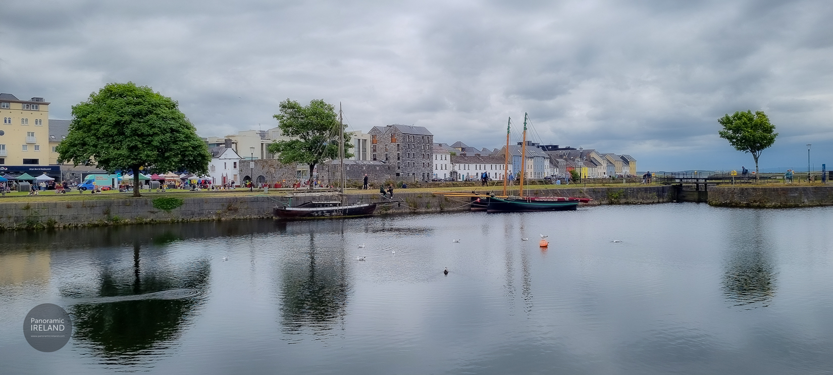 Traditional Galway Hooker boats at the Claddagh, Galway City — summer on the River Corrib
